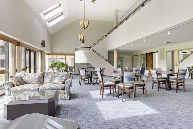 2265 Youngman Ave Unit 207E, Saint Paul, MN 55116 - carpeted living area with high vaulted ceiling and a skylight