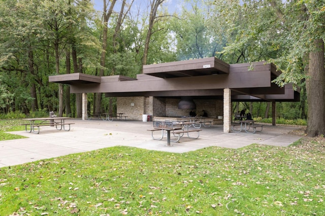 2265 Youngman Ave Unit 207E, Saint Paul, MN 55116 - view of property's community with a patio area and a lawn
