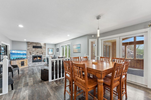 8700 Kilbirnie Ter, Brooklyn Park, MN 55443 - dining room with dark wood-style floors, a fireplace, and recessed lighting