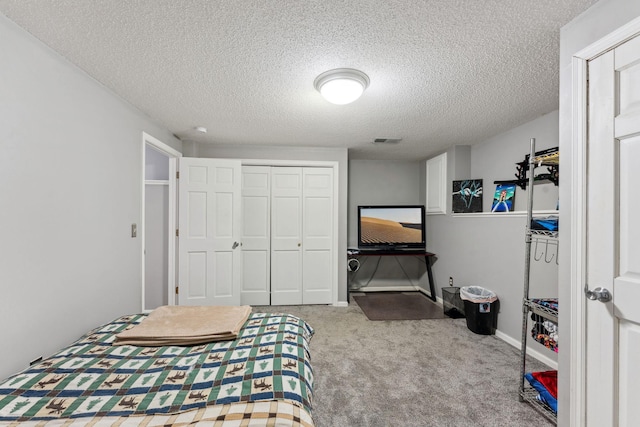 8700 Kilbirnie Ter, Brooklyn Park, MN 55443 - bedroom featuring carpet flooring, a closet, and a textured ceiling