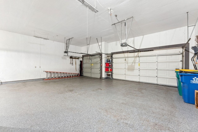 8700 Kilbirnie Ter, Brooklyn Park, MN 55443 - garage featuring a garage door opener