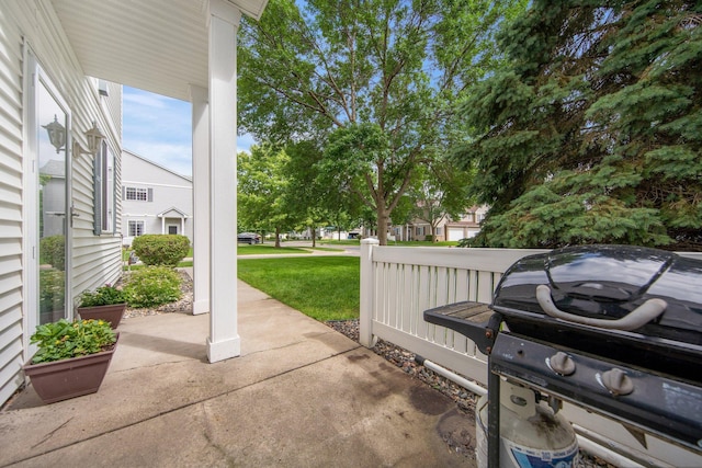 17980 69th Pl N, Maple Grove, MN 55311 - view of patio with area for grilling and a residential view