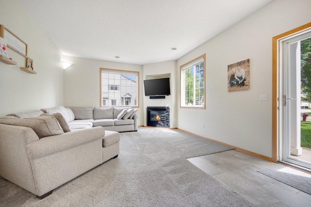 17980 69th Pl N, Maple Grove, MN 55311 - carpeted living area with plenty of natural light and a glass covered fireplace