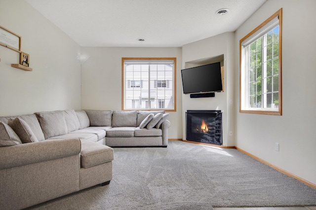 17980 69th Pl N, Maple Grove, MN 55311 - carpeted living area featuring a glass covered fireplace and baseboards