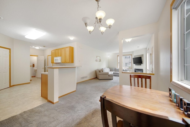 17980 69th Pl N, Maple Grove, MN 55311 - dining space with light carpet and a chandelier