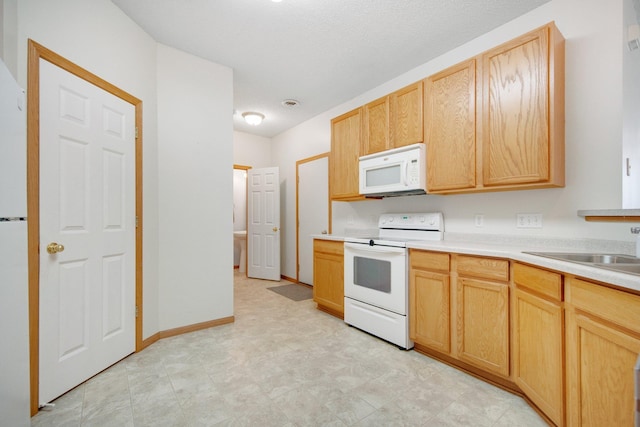 17980 69th Pl N, Maple Grove, MN 55311 - kitchen featuring white appliances, light brown cabinetry, light countertops, and light flooring