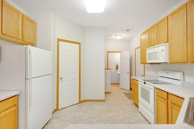 17980 69th Pl N, Maple Grove, MN 55311 - kitchen with white appliances, light brown cabinetry, light countertops, light flooring, and a textured ceiling