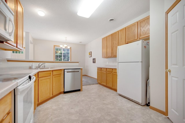 17980 69th Pl N, Maple Grove, MN 55311 - kitchen featuring white appliances, a peninsula, a chandelier, light countertops, and light brown cabinetry