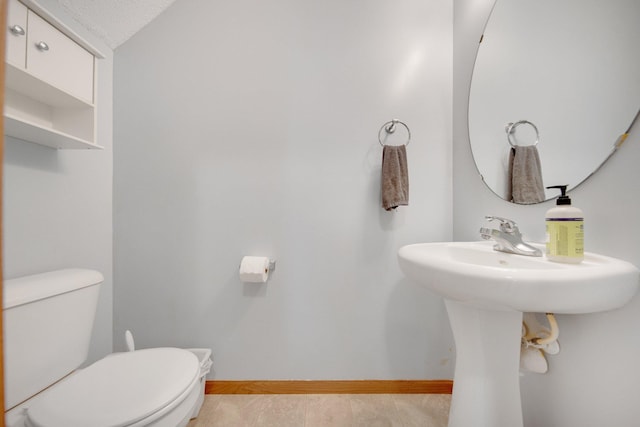 17980 69th Pl N, Maple Grove, MN 55311 - bathroom featuring toilet and baseboards