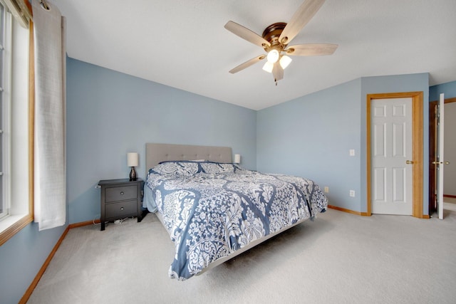 17980 69th Pl N, Maple Grove, MN 55311 - carpeted bedroom with baseboards and a ceiling fan