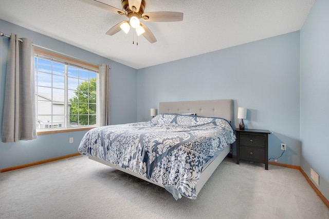 17980 69th Pl N, Maple Grove, MN 55311 - bedroom featuring carpet floors, ceiling fan, and a textured ceiling