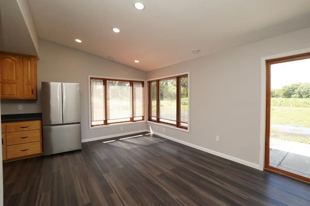 1722 41st Ave NE, Dovre Twp, MN 56201 - kitchen with freestanding refrigerator, dark wood-type flooring, recessed lighting, dark countertops, and lofted ceiling