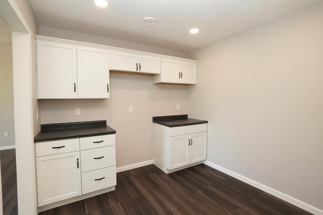 1722 41st Ave NE, Dovre Twp, MN 56201 - kitchen with dark countertops, dark wood finished floors, white cabinets, and recessed lighting