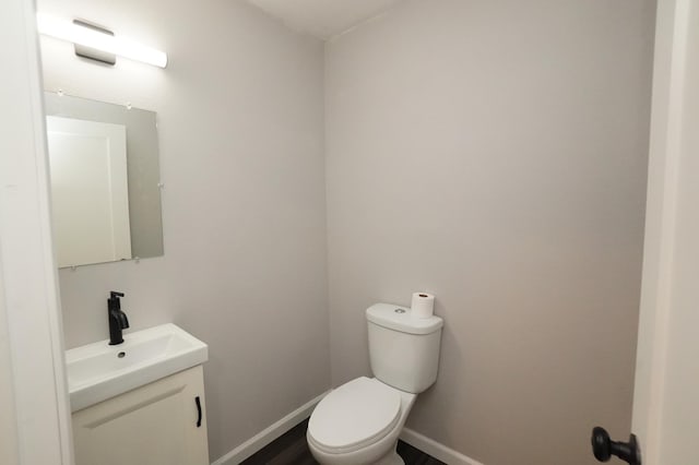 1722 41st Ave NE, Dovre Twp, MN 56201 - half bathroom featuring vanity and toilet