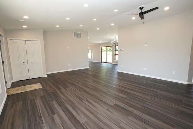 1722 41st Ave NE, Dovre Twp, MN 56201 - unfurnished living room with ceiling fan, a chandelier, dark wood-style floors, lofted ceiling, and recessed lighting