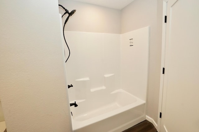 1722 41st Ave NE, Dovre Twp, MN 56201 - bathroom with bathing tub / shower combination and wood finished floors