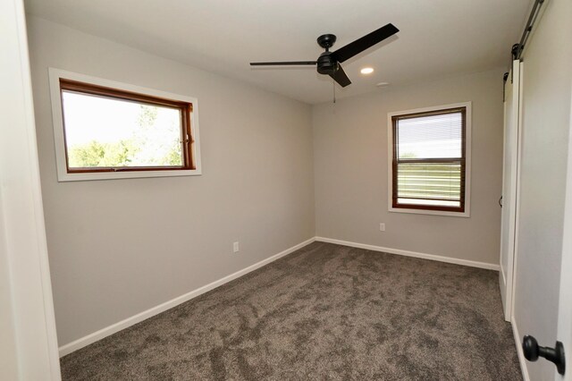 1722 41st Ave NE, Dovre Twp, MN 56201 - empty room with a ceiling fan, dark colored carpet, and recessed lighting