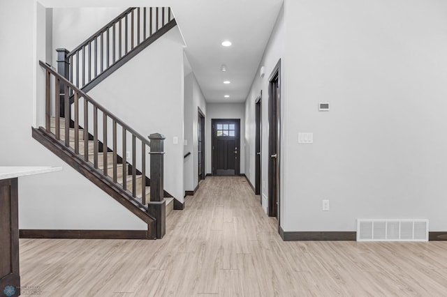 3702 Houkom Dr E, Fargo, ND 58078 - foyer entrance with light wood-style flooring, stairway, and recessed lighting