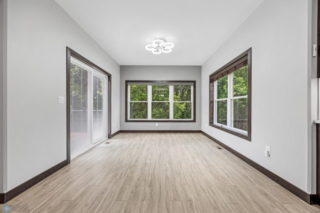 3702 Houkom Dr E, Fargo, ND 58078 - unfurnished sunroom featuring a chandelier