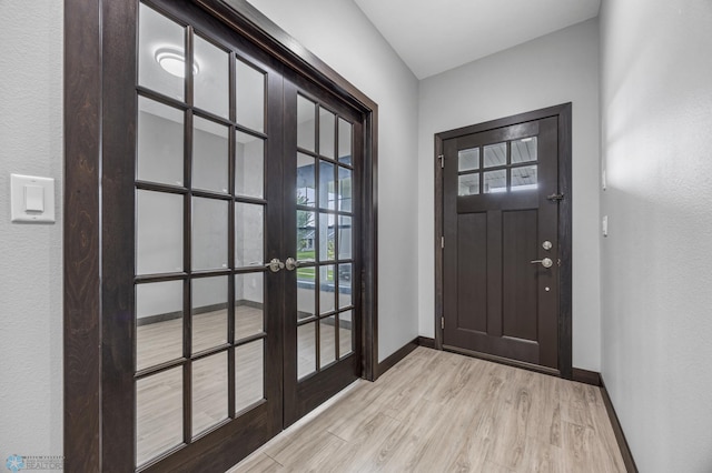 3702 Houkom Dr E, Fargo, ND 58078 - entryway featuring light wood-style flooring and french doors