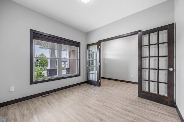 3702 Houkom Dr E, Fargo, ND 58078 - spare room featuring baseboards and wood finished floors