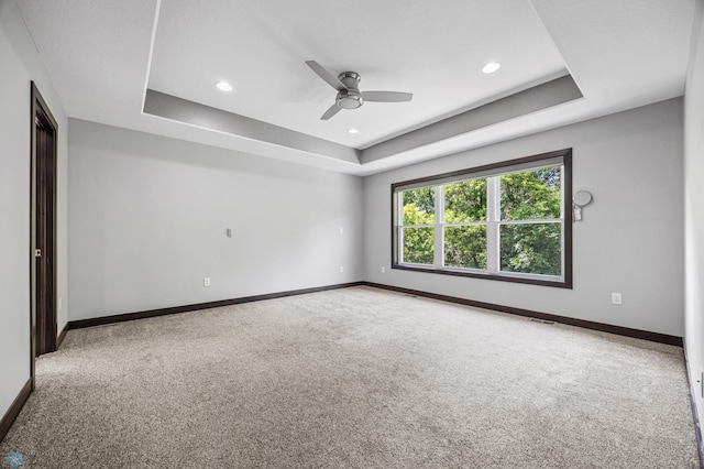 3702 Houkom Dr E, Fargo, ND 58078 - empty room with carpet floors, a tray ceiling, ceiling fan, and recessed lighting