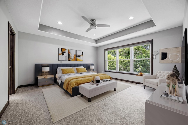 3702 Houkom Dr E, Fargo, ND 58078 - carpeted bedroom featuring a raised ceiling, recessed lighting, and ceiling fan