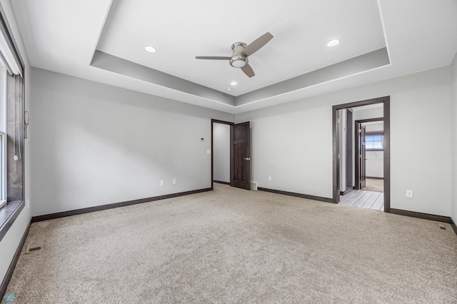 3702 Houkom Dr E, Fargo, ND 58078 - carpeted empty room with a raised ceiling, a ceiling fan, and recessed lighting