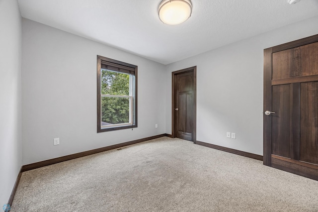 3702 Houkom Dr E, Fargo, ND 58078 - unfurnished bedroom featuring carpet flooring