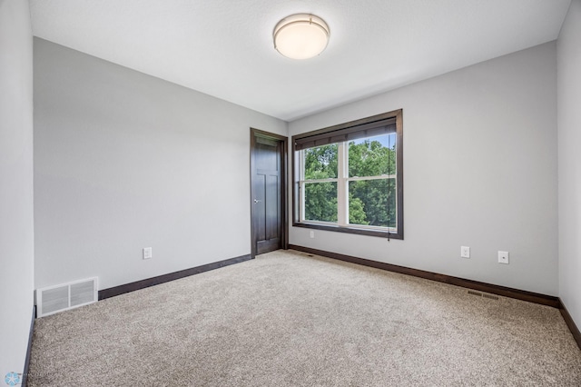 3702 Houkom Dr E, Fargo, ND 58078 - carpeted empty room featuring baseboards