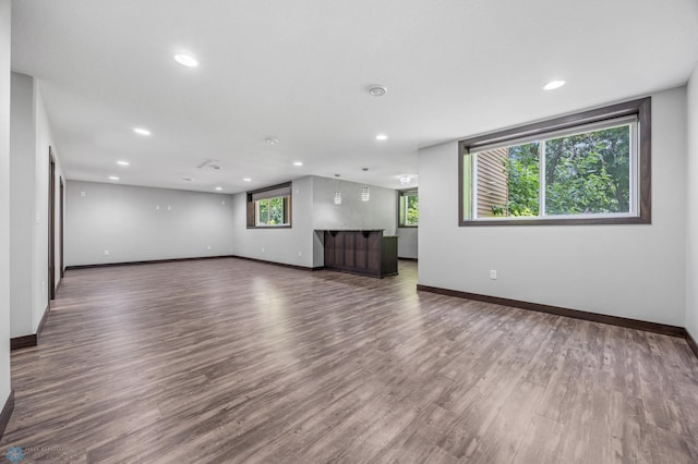 3702 Houkom Dr E, Fargo, ND 58078 - unfurnished living room with wood finished floors and recessed lighting