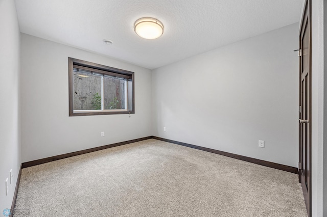 3702 Houkom Dr E, Fargo, ND 58078 - spare room featuring carpet floors and baseboards