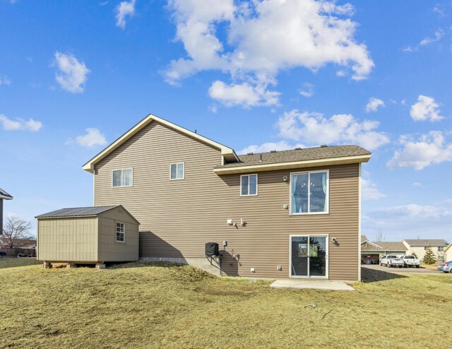 230 Newspaper Run NE, Kimball, MN 55353 - rear view of property featuring a lawn, a patio, and roof with shingles