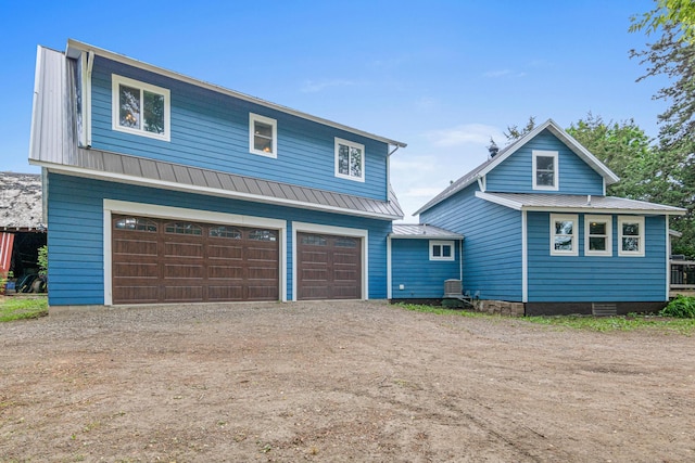 2565 Highland Rd, Minnetrista, MN 55359 - view of front of home with driveway, a metal roof, and an attached garage