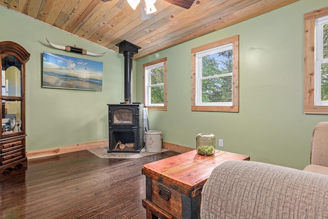 2565 Highland Rd, Minnetrista, MN 55359 - living area featuring a wood stove, wooden ceiling, a ceiling fan, and hardwood / wood-style flooring