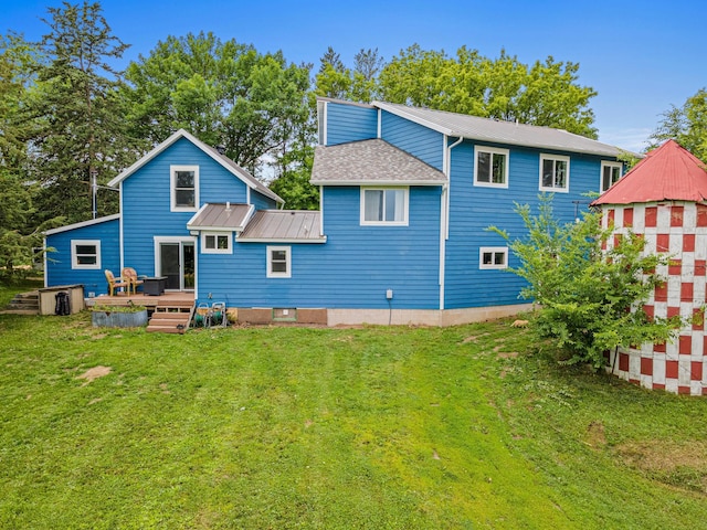 2565 Highland Rd, Minnetrista, MN 55359 - back of house with a yard, a deck, and a metal roof