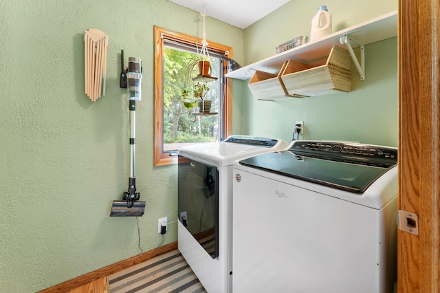 19172 Front Blvd NE, East Bethel, MN 55092 - laundry room featuring separate washer and dryer and baseboards