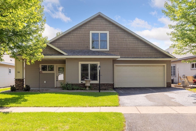 98 Tribute Ave, Hudson, WI 54016 - craftsman inspired home with driveway, a front lawn, stone siding, and an attached garage