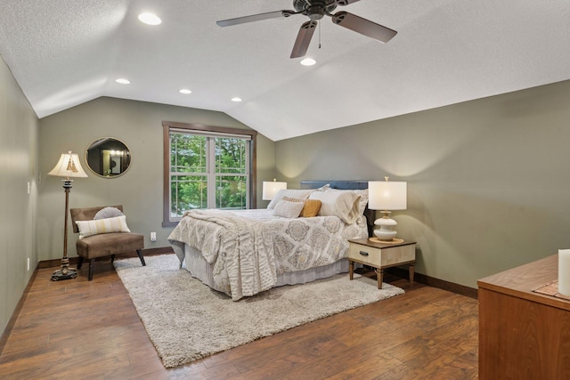 98 Tribute Ave, Hudson, WI 54016 - bedroom with lofted ceiling, dark wood-type flooring, a ceiling fan, recessed lighting, and a textured ceiling