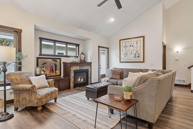 98 Tribute Ave, Hudson, WI 54016 - living area with wood finished floors, a ceiling fan, a high end fireplace, high vaulted ceiling, and recessed lighting