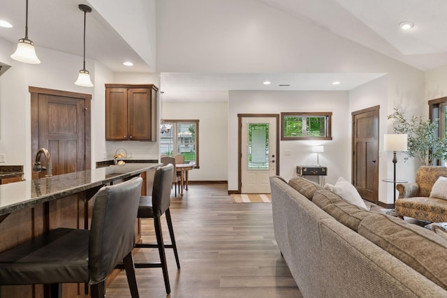 98 Tribute Ave, Hudson, WI 54016 - living room with vaulted ceiling, light wood-style flooring, and recessed lighting