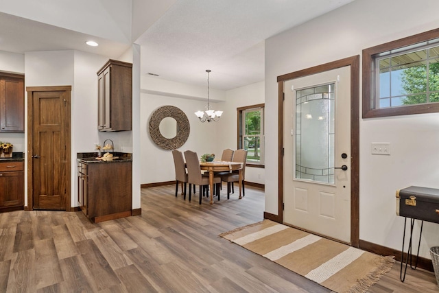 98 Tribute Ave, Hudson, WI 54016 - foyer with plenty of natural light, light wood-style flooring, a chandelier, and recessed lighting