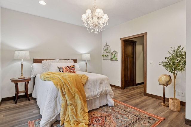 98 Tribute Ave, Hudson, WI 54016 - bedroom with a chandelier, wood finished floors, and recessed lighting