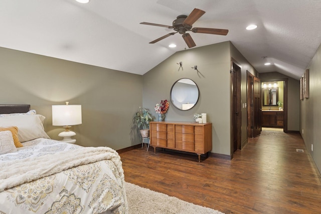 98 Tribute Ave, Hudson, WI 54016 - bedroom featuring lofted ceiling, dark wood-type flooring, recessed lighting, ensuite bathroom, and ceiling fan