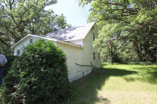 24195 Center St E, Mayfield Twp, MN 56701 - view of home's exterior with roof with shingles and a yard