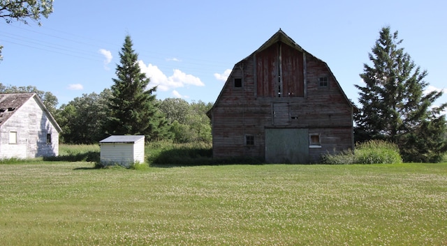 24195 Center St E, Mayfield Twp, MN 56701 - view of home's exterior with a barn, an outbuilding, and a yard