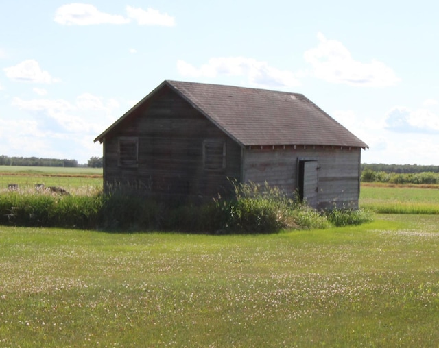 24195 Center St E, Mayfield Twp, MN 56701 - view of barn featuring a lawn