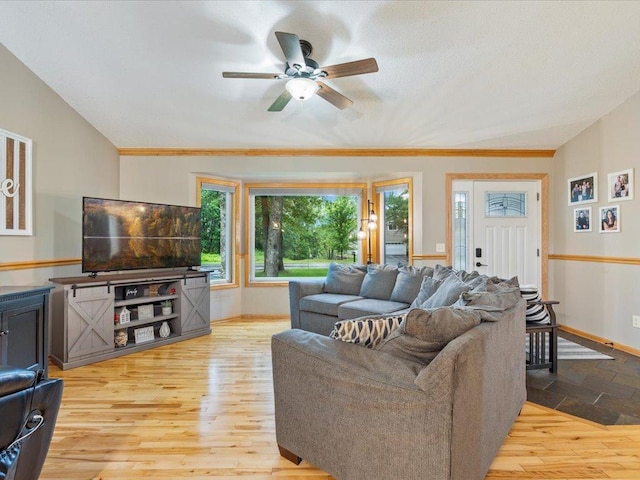 4669 Brentwood Rd, Baxter, MN 56425 - living room featuring a ceiling fan, wood finished floors, lofted ceiling, and ornamental molding