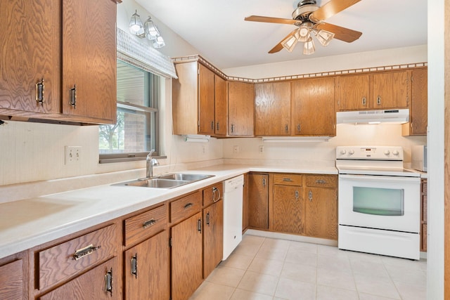 1200 18th Ave NW Unit 132, Austin, MN 55912 - kitchen featuring under cabinet range hood, white appliances, brown cabinets, and light countertops