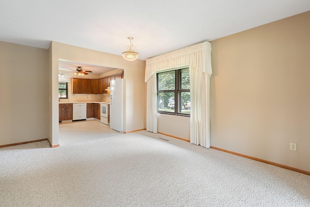 1200 18th Ave NW Unit 132, Austin, MN 55912 - unfurnished living room with healthy amount of natural light, light carpet, and ceiling fan